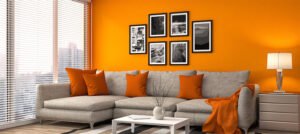 A vibrant home decor featuring orange paint on the walls, adding warmth and energy to the room